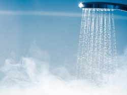 Hot water spraying from a shower faucet 
