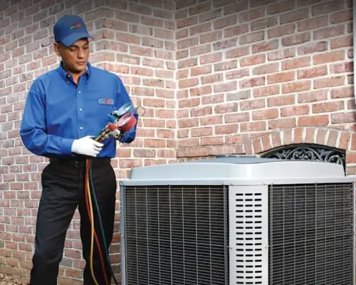 ARS Technician performing HVAC maintenance on residential system.